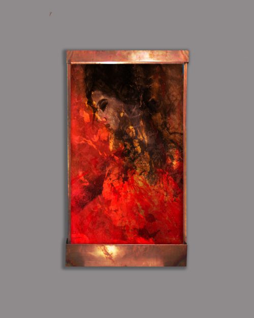 Beautiful wall fountain of a woman in red and gold in a Spanish abstract style.